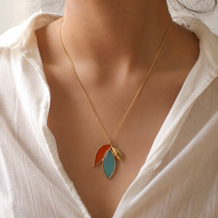 Model wearing the TerraFusion Gems Autumn Leaf Blue Sky Agate Necklace handcrafted with genuine Blue Sky Agate and 18k gold plating.