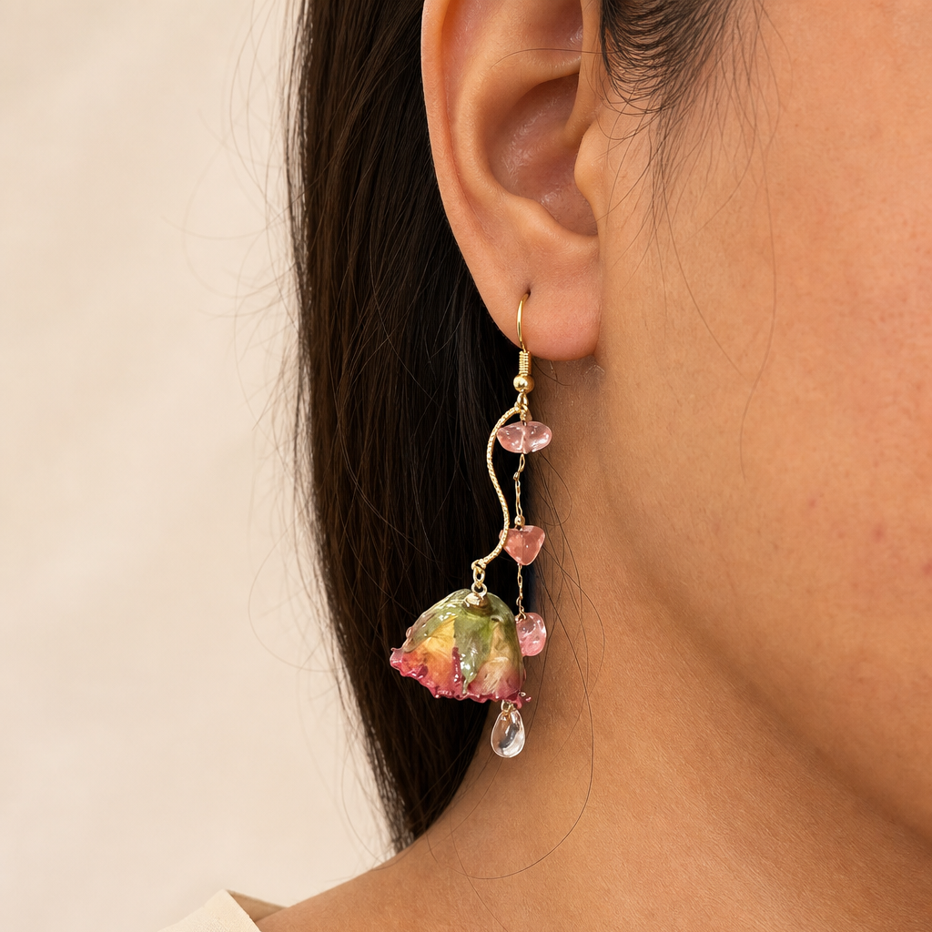 Long garden rose vine earrings worn on the ear