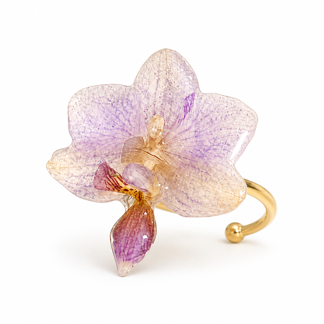 Side view of lavender orchid resin ring with adjustable gold-tone band
