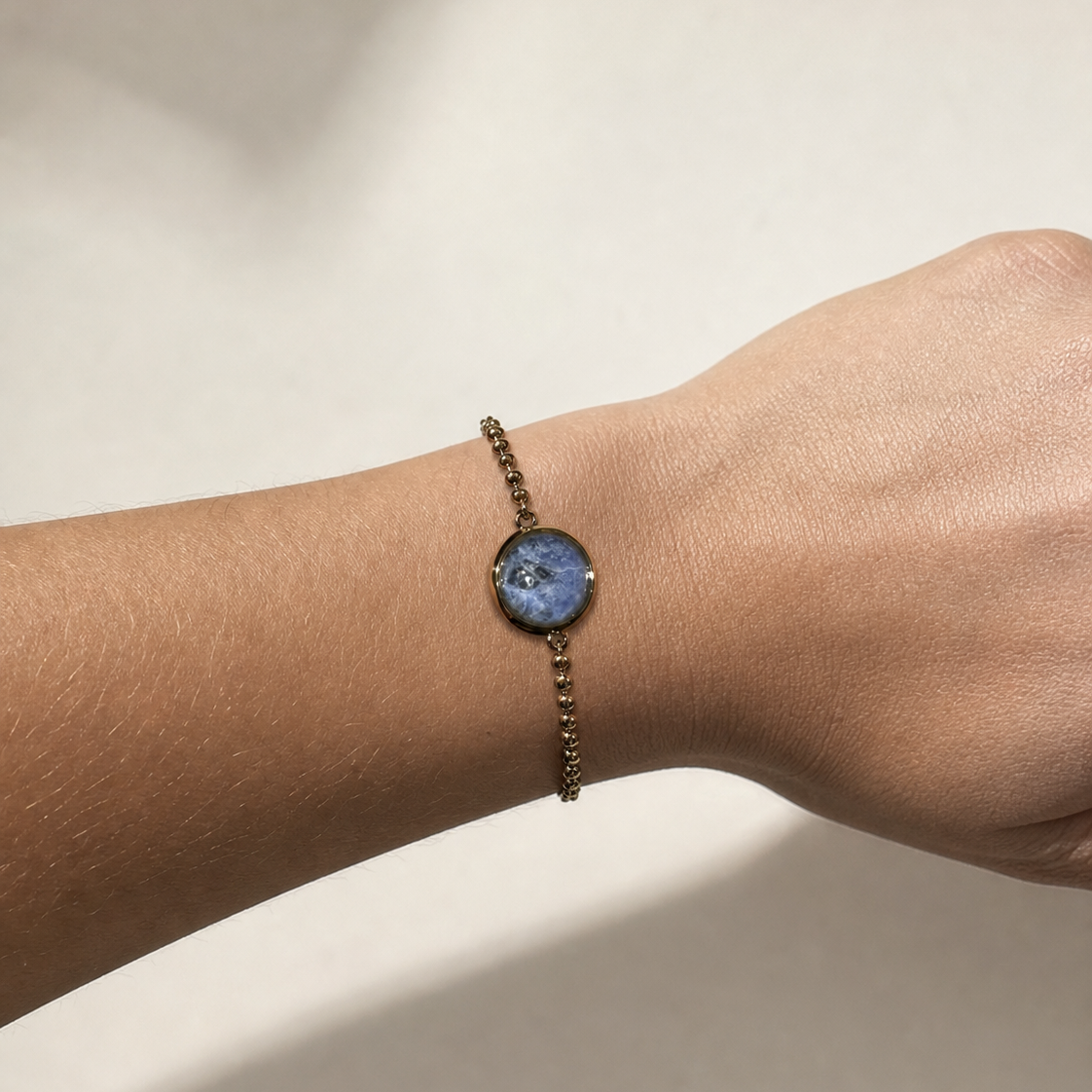 Pedras do Brasil natural stone bracelet with gold-tone PVD finish worn